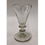 A large Georgian style wine/ale glass, conical bowl, collar, stem with blade knop, thick flat