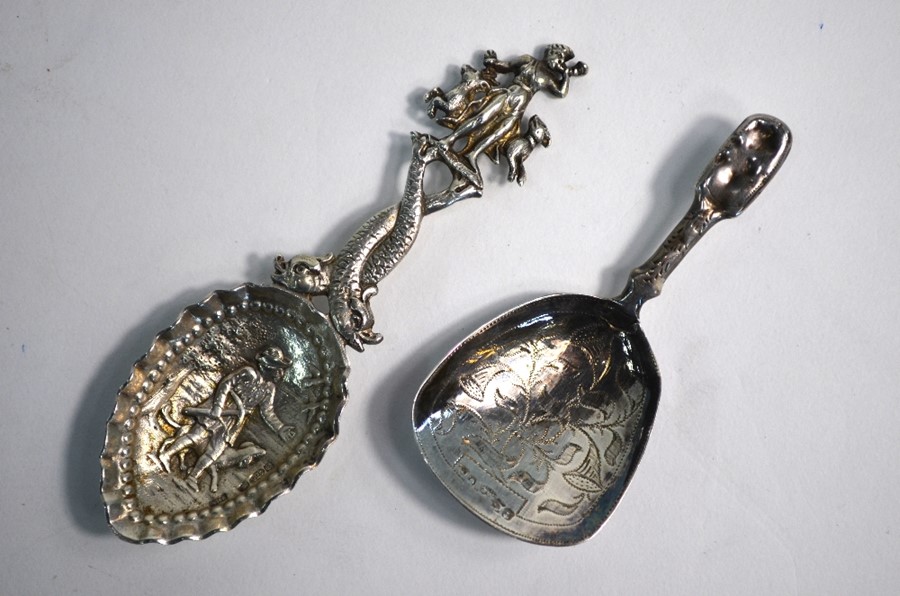 A Continental cast silver caddy spoon with decorative stem and engraved bowl, London import 1905,