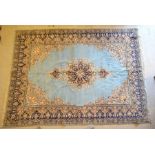 An Indo-Persian Quom carpet, pale blue ground flanked by floral medallions, 3.0 x 2.0 m