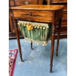 A Victorian crossbanded mahogany work table, the hinged top enclosing a fitted interior over a
