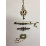 A collection of antique jewellery including an Art Nouveau scrollwork pendant set amethyst and