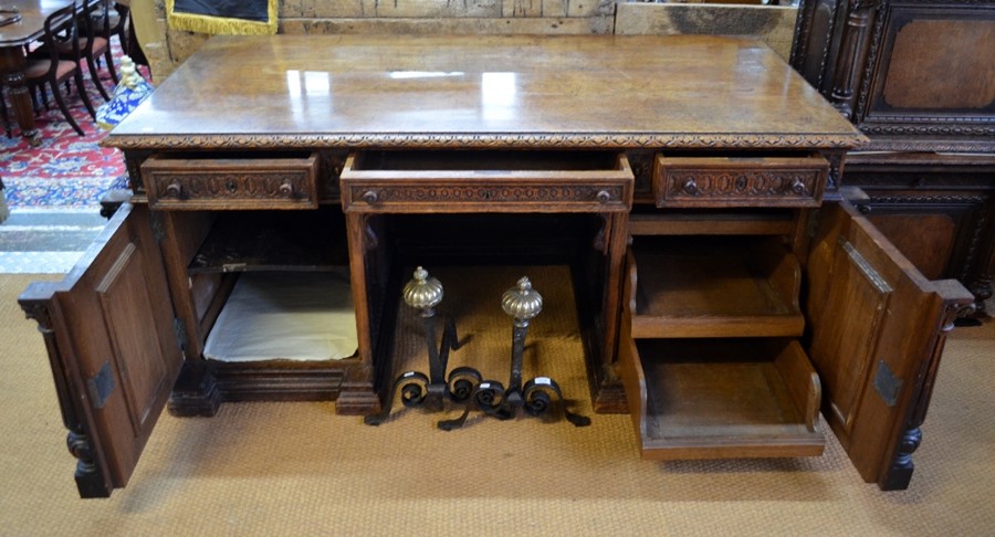 A 19th century Flemish oak pedestal desk, the wide cross-banded top with moulded edge over three - Image 4 of 7