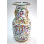 A Chinese Canton famille rose vase, decorated with typical designs of Manchu/Chinese figures and