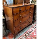 A 19th century mahogany chest of two short over three long graduated drawers with original turned