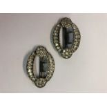A pair of oval Victorian buckles, paste set on white metal fittings stamped 800, 5.5 x 4 cm