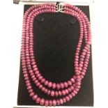 A three-row graduated ruby bead necklace