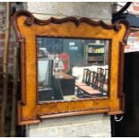A burr walnut framed wall mirror with heavily moulded edge, 76 cm h x 90 cm w