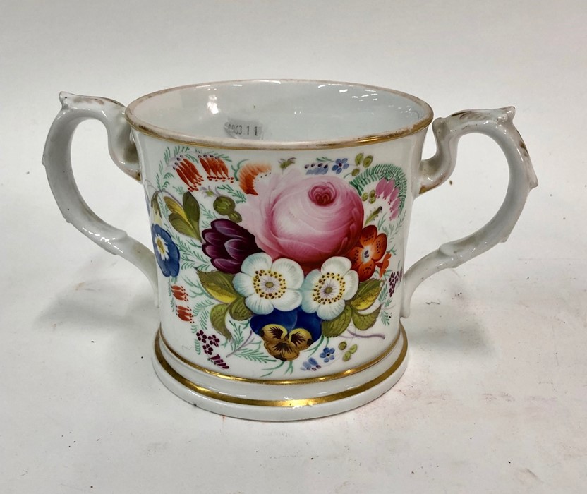 Of Military Interest - A Victorian Staffordshire loving cup,  painted polychrome flowers to one side