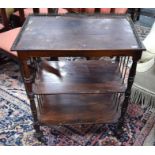 A Victorian rosewood three tier what not, with gilt metal gallery raised on turned feet to brass