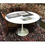 Eero Saarinen for Arkana, a white circular tulip form dining table, 121 cm dia. x 73 cm h