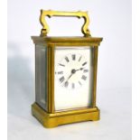 A brass carriage clock with white enamelled dial (no key)