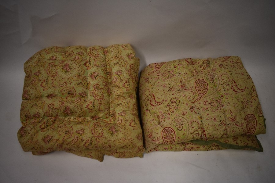 Two single vintage paisley and floral eiderdowns in pastel shadesNo holes or stains