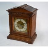 A German oak mantel clock, the eight-day two train movement by Lenzkirch striking on a spiral