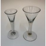 A Georgian wine glass with drawn trumpet bowl, plain stem, conical base, rough pontil, 16.8 cm