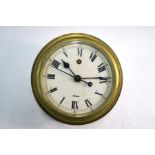 A vintage 8-day single fusee brass bulkhead clock, the white enamelled dial with Roman numerals,