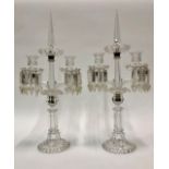 A pair of 19th century pressed and cut glass girandoles, hollow glass stems, hanging lustres from