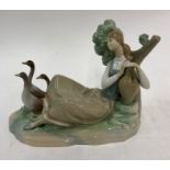 A Lladro figure of a seated girl with three geeseGood condition - no chips or cracks