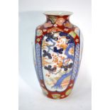 A Japanese Fukagawa Imari oviform vase, decorated with panels depicting pine and floral