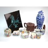 A quantity of Chinese Ceramics, comprising: a Yixing teapot and cover, 18 cm wide; a blue and