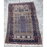 An old Afghan Baluch 'Seh Mihrab' prayer rug, circa 1920 1.39 x .83 m [526]
