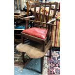 A George III mahogany childs high chair with shaped arms over a drop in seat raised on a shaped