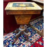 A Victorian walnut work table, the top with inlaid floral urn design hinged to reveal a paper