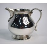 A heavy quality silver squat pear-shaped cream jug, William Comyns & Sons Ltd., London 1963, 7.8 oz