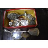 A quantity of silver items including candlesticks, brushes and hand-mirror, toilet jars and