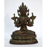 An Indo-Tibetan metal figure of Vajrapani or Avalokitesvara, seated in dhyanasana on a double