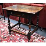 A 17th century oak/fruitwood side table, the moulded  three plank top over a frieze drawer, raised