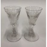 A pair of 19th century wine glasses - round funnel cut bowl engraved with three images - grapes
