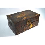 A Chinese lacquered and painted box with hinged top and lower drawer (a/f), 41 cm wide