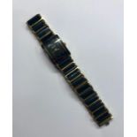 A black and gilt metal lady's wristwatch with rectangular face by Rado