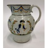 An early 19th century Pratt pearlware jug moulded in relief with images of Nelson and HMS Victory