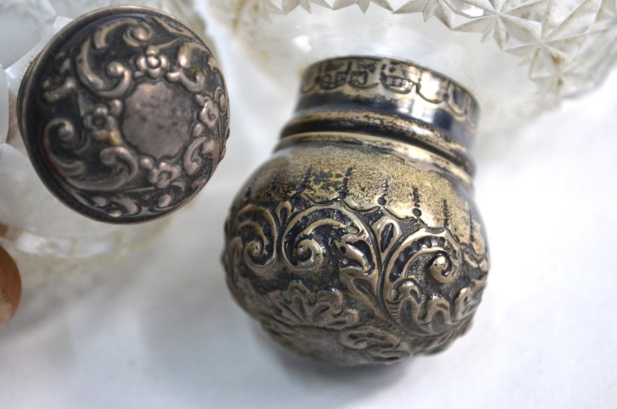 Eight silver-topped cut glass toilet bottles and jars, W & G Neal, London 1910 - Image 3 of 4