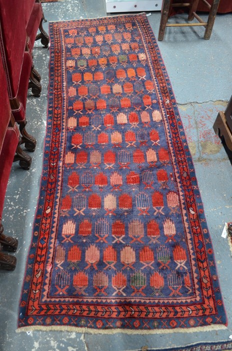 An old Persian Hamadan runner, the repeating geometric design on ink-blue ground, 2.80 x 1.00 m [