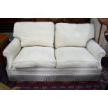 George Smith Ltd., a contemporary two seater sofa upholstered in oatmeal chenille fabric with all-