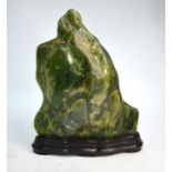 A mottled green Gongshi designed as a mountain, possibly as a reference to China's Wuyue (Five