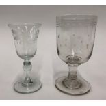 A Georgian wine glass - bell shaped bowl engraved with tulips, beaded ball knop collar over an