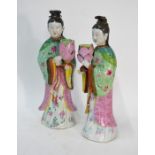 An elegant pair of famille rose figures; each one designed as a high ranking Manchu/Chinese lady