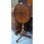 A 19th century mahogany circular tilt top occasional table, raised on a tripod base, 53 cm dia. x 71