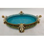 A Victorian Minton Majolica large oval table centrepiece of basket weave form, raised on four