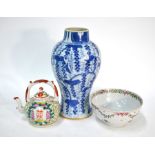 A Chinese blue and white baluster vase, decorated with floral designs, 23 cm high; together with a
