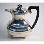 A silver hot water jug in the Regency style, with gadrooned rim and bun feet, J. B. Chatterley &