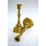 A pair of 19th century French cast and gilded bronze candlesticks in the Baroque manner, with