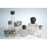 Eight silver-topped cut glass toilet bottles and jars, W & G Neal, London 1910