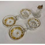 Two French glass teste-vins with cut and gilded strawberry and leaf decoration to/w a pair of