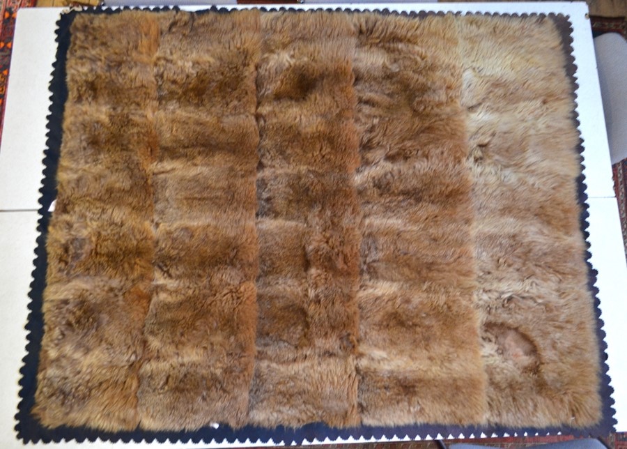 An early 20th century Australian fur rug with felt backing, label for 'P Lawrence, Furrier and Rug