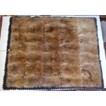 An early 20th century Australian fur rug with felt backing, label for 'P Lawrence, Furrier and Rug