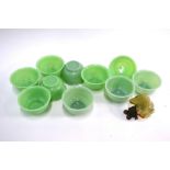 A set of ten Beijing, green glass bowls, each one 11 cm diameter; together with a Chinese bowenite